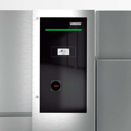 Control panel with display, green bar, and red sensor on a stainless steel appliance