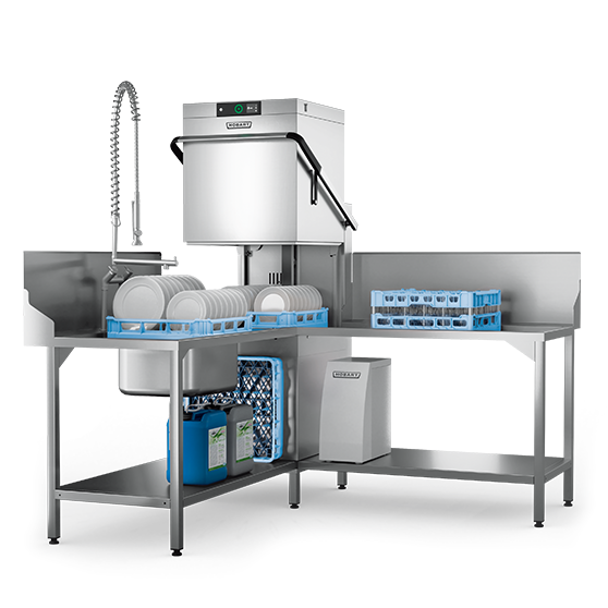 Corner installation of a HOBART AUPT hood‑type dishwasher integrated into a stainless‑steel dishwashing station, equipped with a pre‑rinse spray unit, dish racks, chemical containers and under‑table storage, showing an efficient space‑saving layout for professional warewashing areas.
