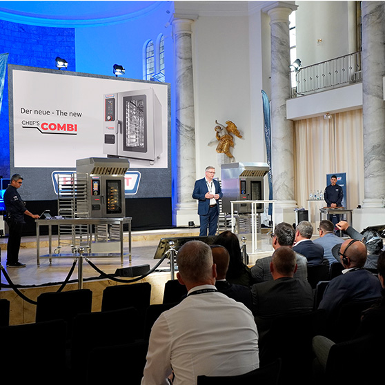 Stage presentation of the new CHEF'S COMBI by HOBART in front of a professional audience in a formal setting