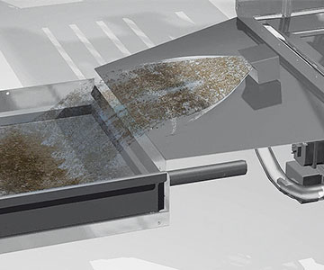  Close-up of the ASR² soil removal system in the FLOW Line autoLINE featuring a stainless steel chute for automatic removal of food residues, AI-controlled cycle for optimal wash liquor and reduced water consumption.