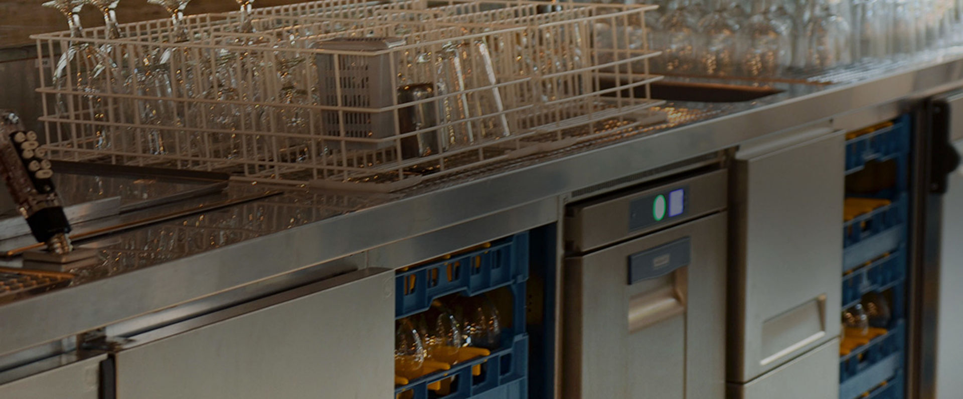 Close‑up of the bar workstation at Stone Brewing Berlin featuring HOBART glasswashing equipment with organized racks of glassware ready for efficient cleaning.